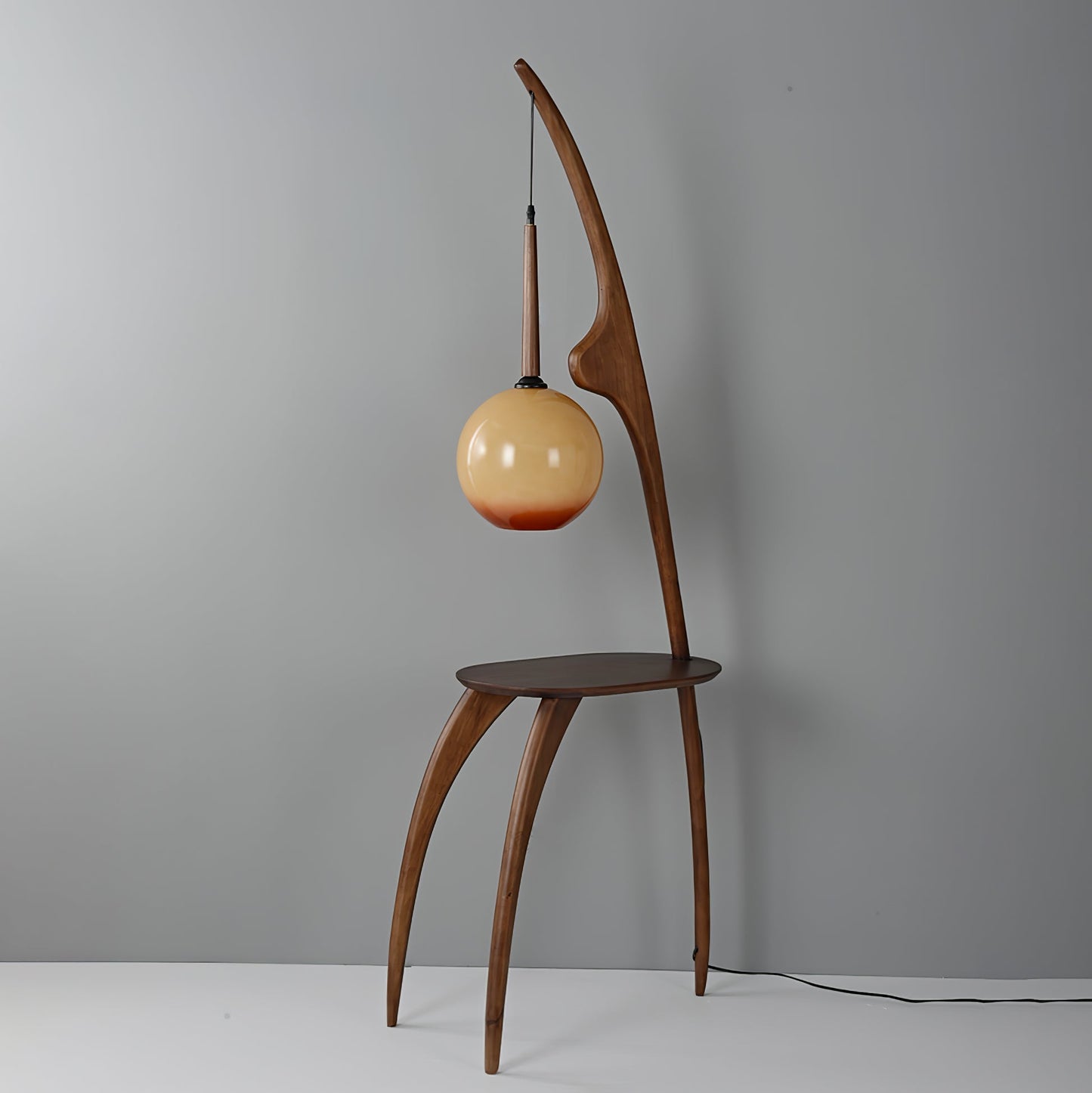 Curved Mantis Arm Floor Lamp with Amber Glass Shade