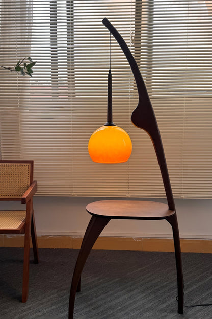 Curved Mantis Arm Floor Lamp with Amber Glass Shade