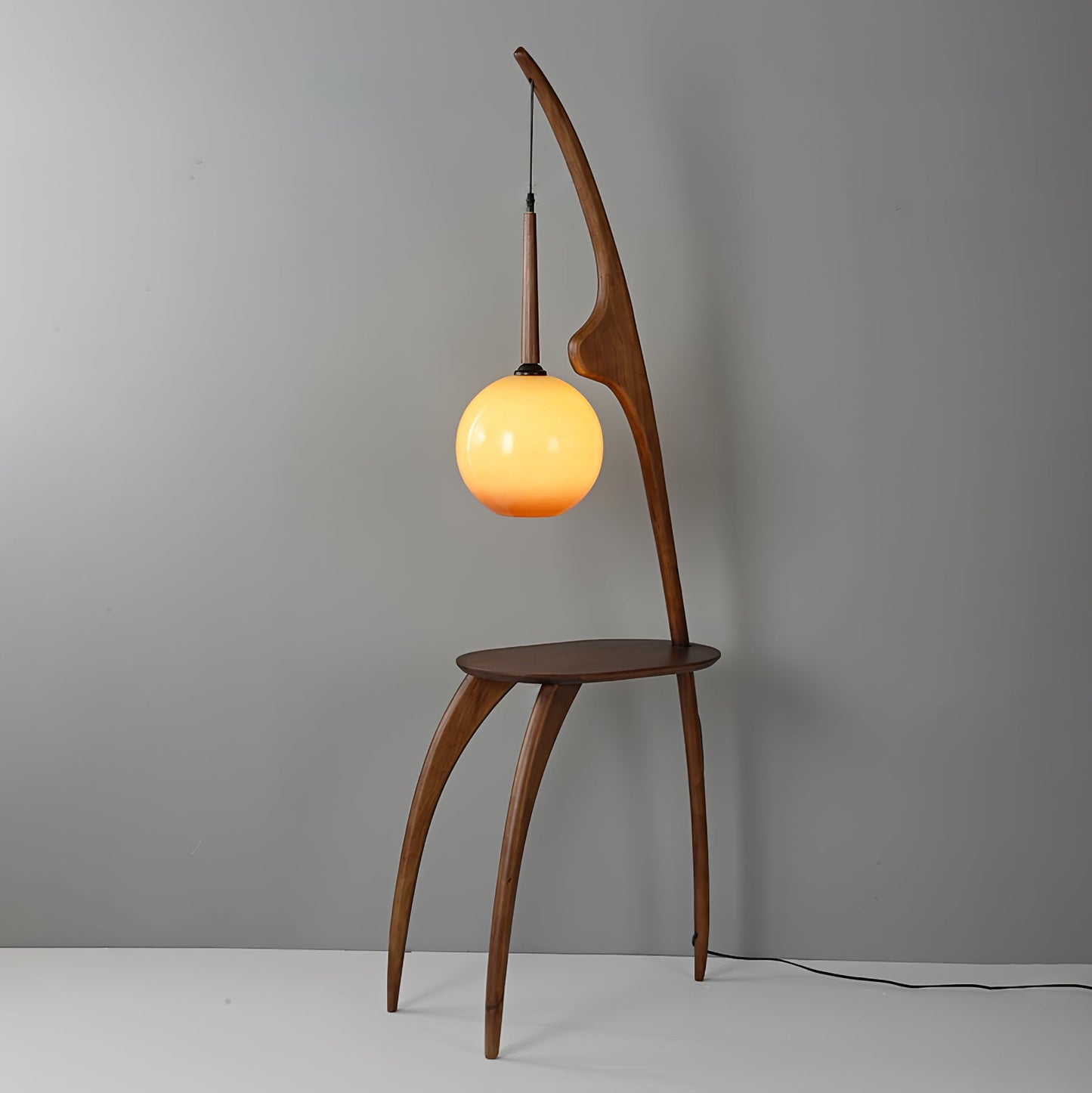 Curved Mantis Arm Floor Lamp with Amber Glass Shade