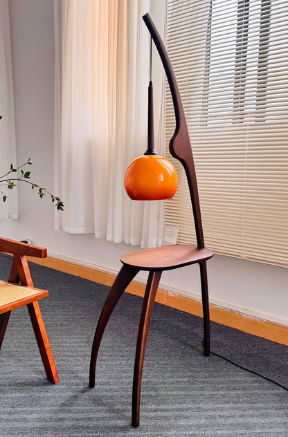 Curved Mantis Arm Floor Lamp with Amber Glass Shade