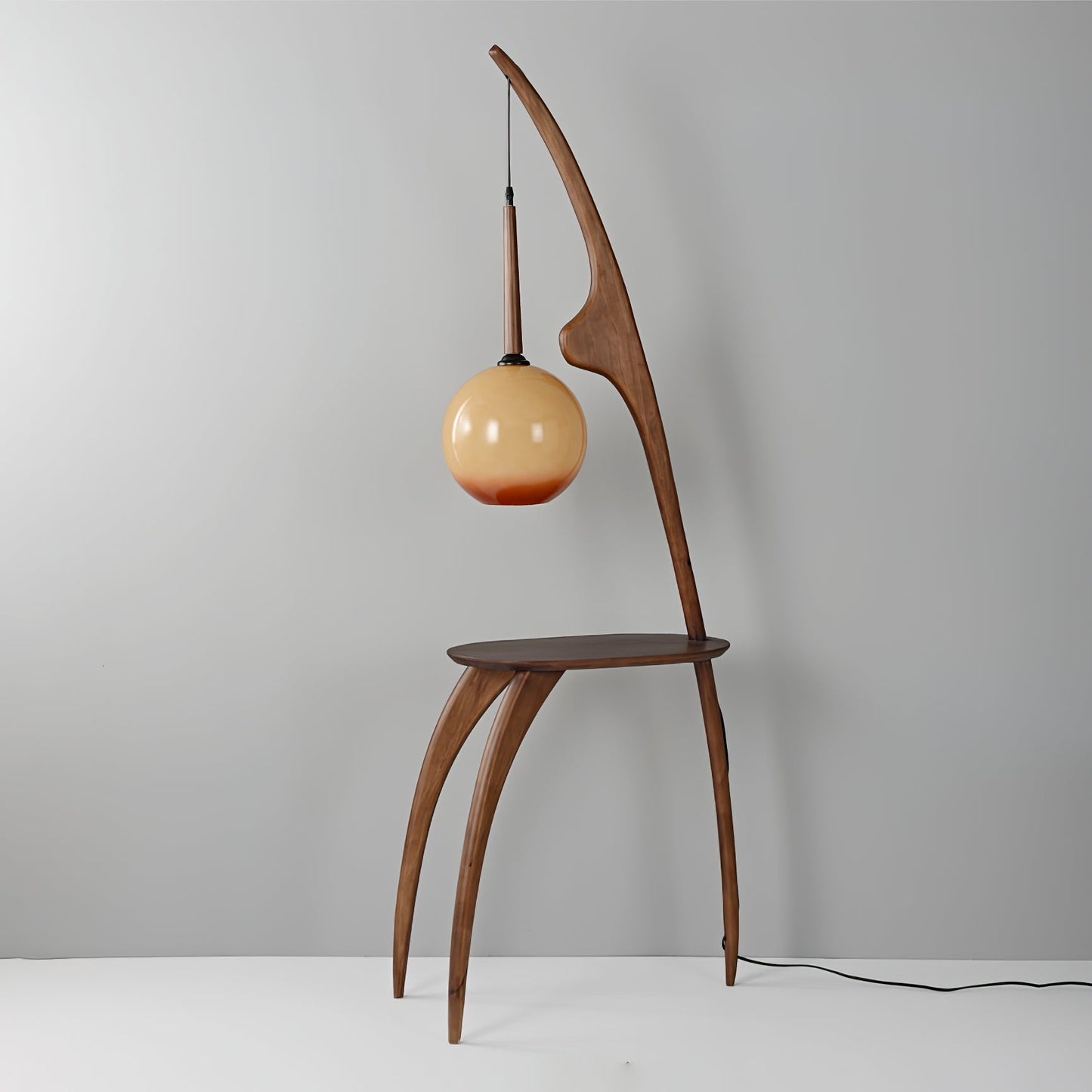 Curved Mantis Arm Floor Lamp with Amber Glass Shade
