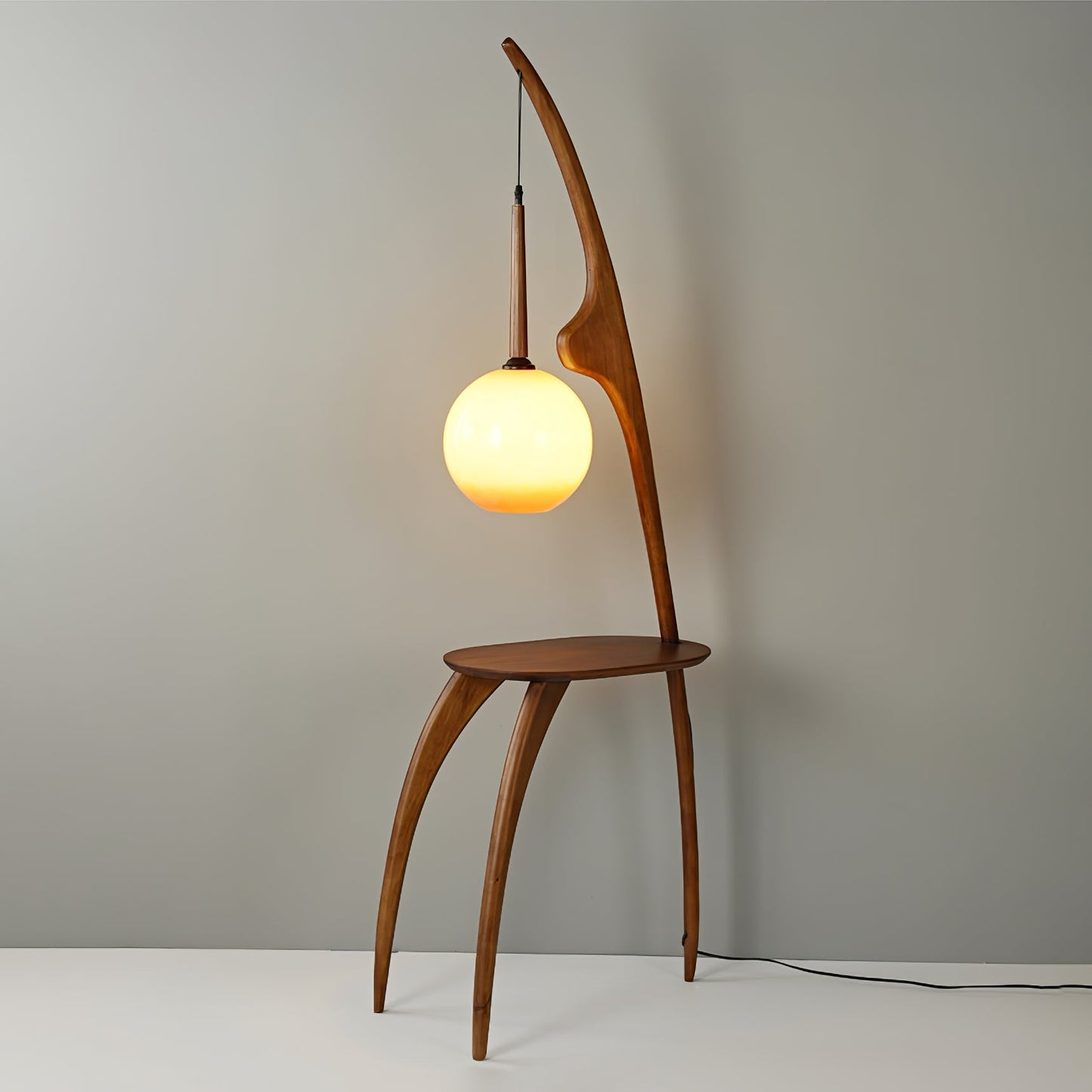 Curved Mantis Arm Floor Lamp with Amber Glass Shade